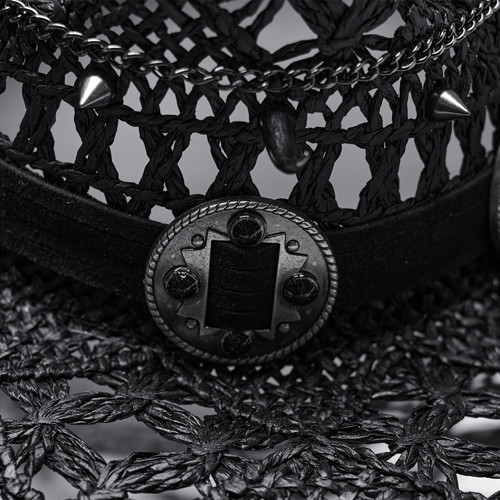 Close-up of a stylish Gothic straw cowboy hat featuring spikes, chains, and a decorative belt design.