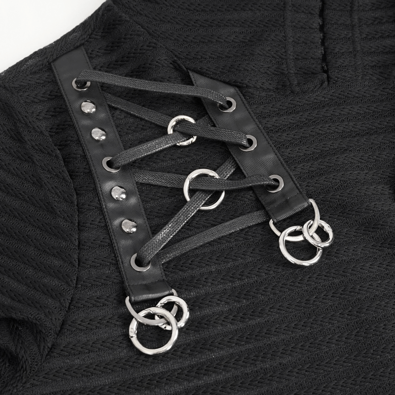 Close-up of gothic lace-up detail with rings on a black hoodie, showcasing unique fashion flair for modern style.