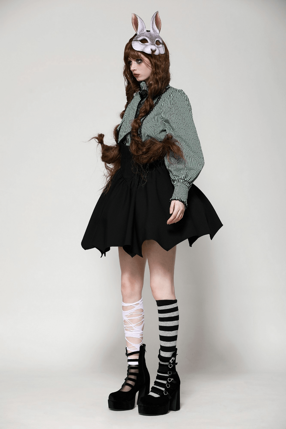 Gothic A-line skirt with asymmetrical hem and striped socks, featuring a whimsical touch with animal ears.