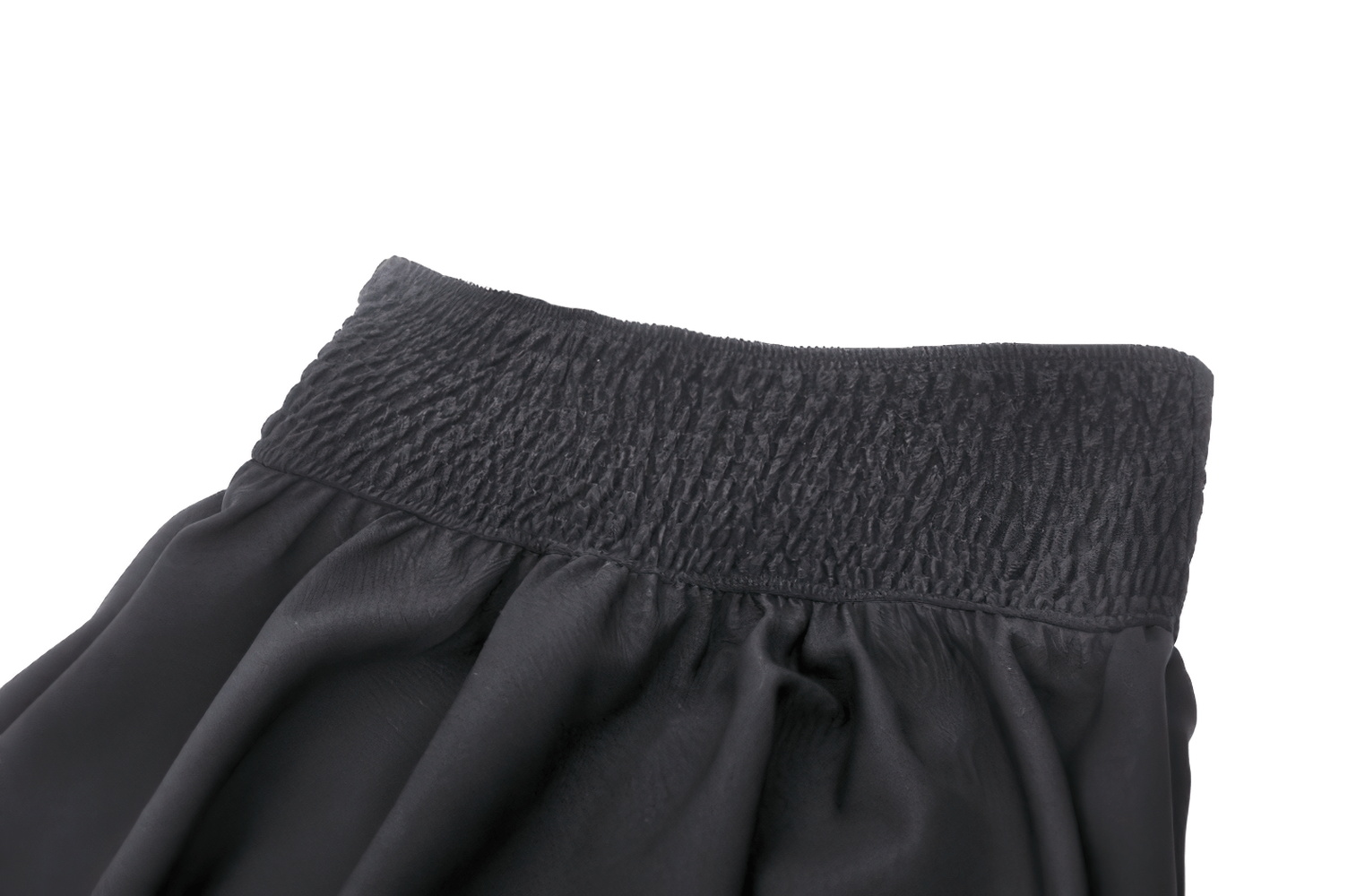 Close-up of black gothic A-line skirt with structured waistband and dramatic flair.