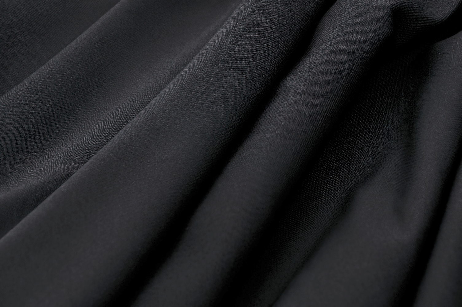 Elegant black fabric showcasing luxurious texture, perfect for a gothic structured A-line skirt with asymmetrical hem.