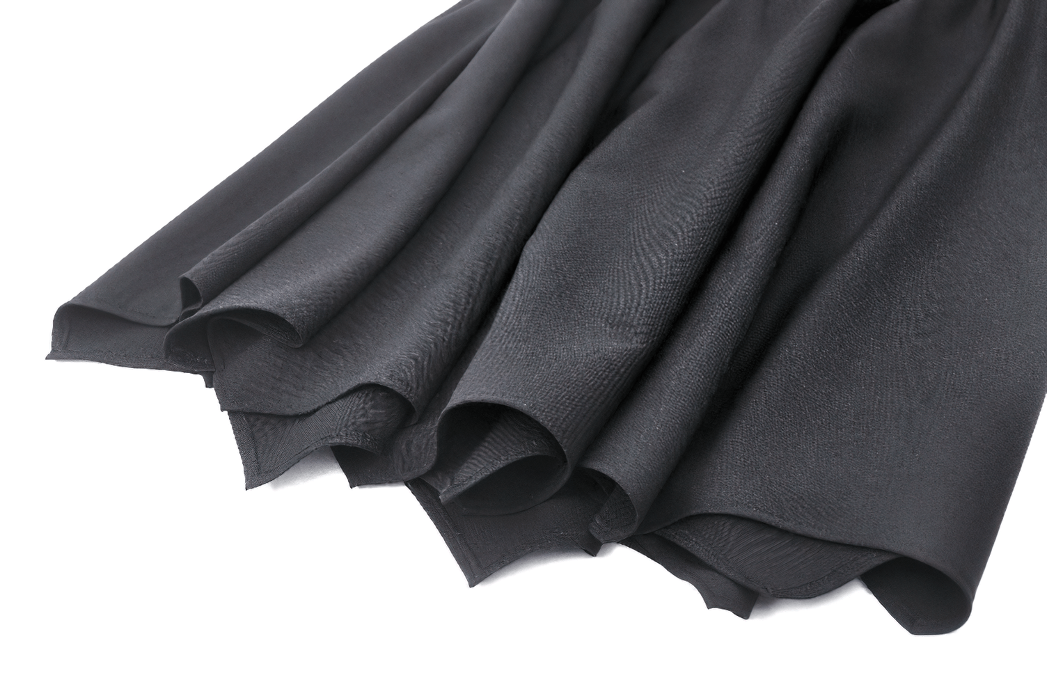 Close-up of gothic black A-line skirt with dramatic asymmetrical hem and elegant flared design.