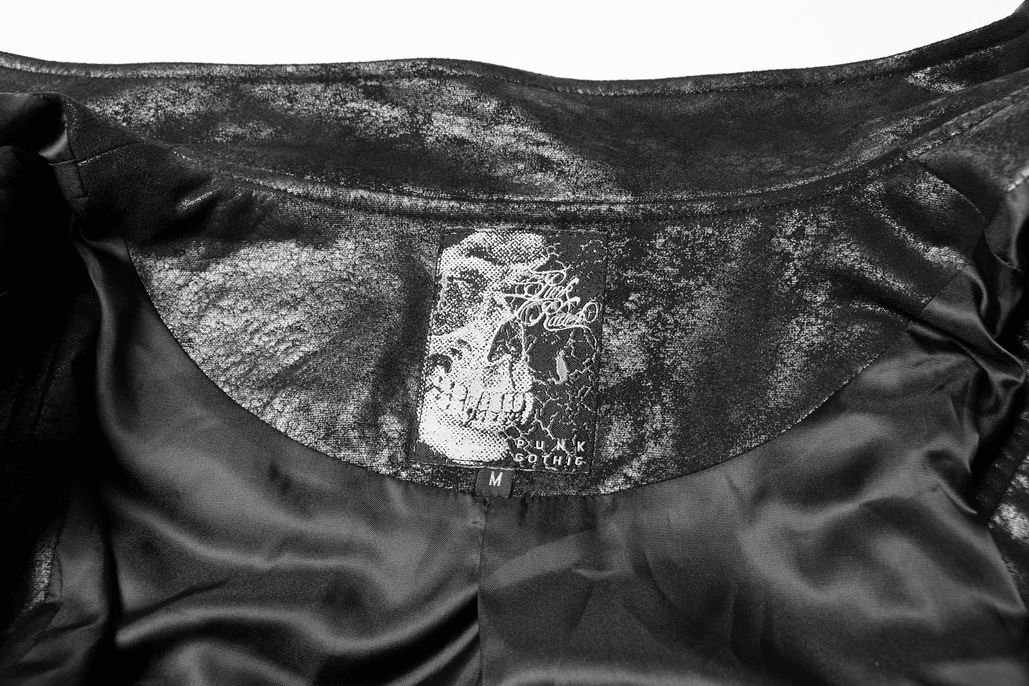 Gothic style black leather cape interior with skull logo and label.