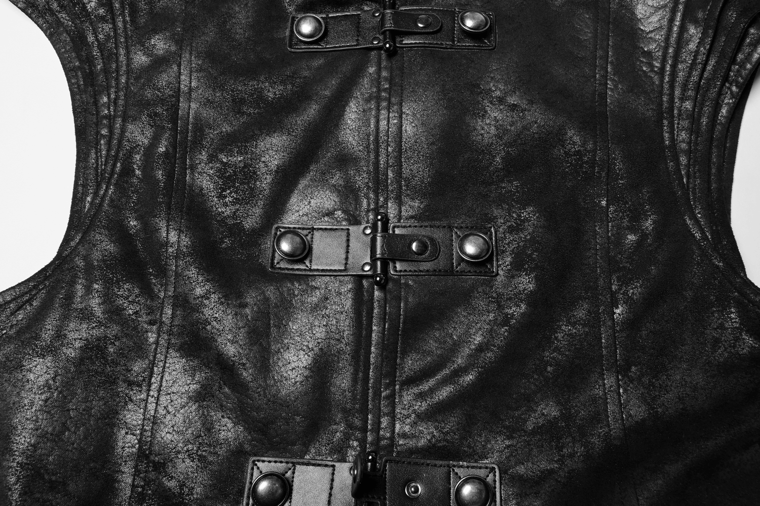 Close-up of Gothic black leather fabric with buckle details and a textured finish for a stylish cape.