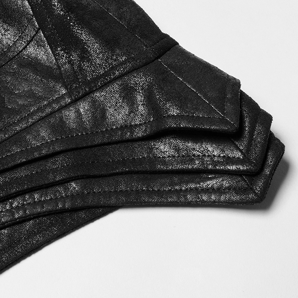 Close-up of folded black leather stacked sleeves from a Gothic style long cape for men, showcasing texture and design.