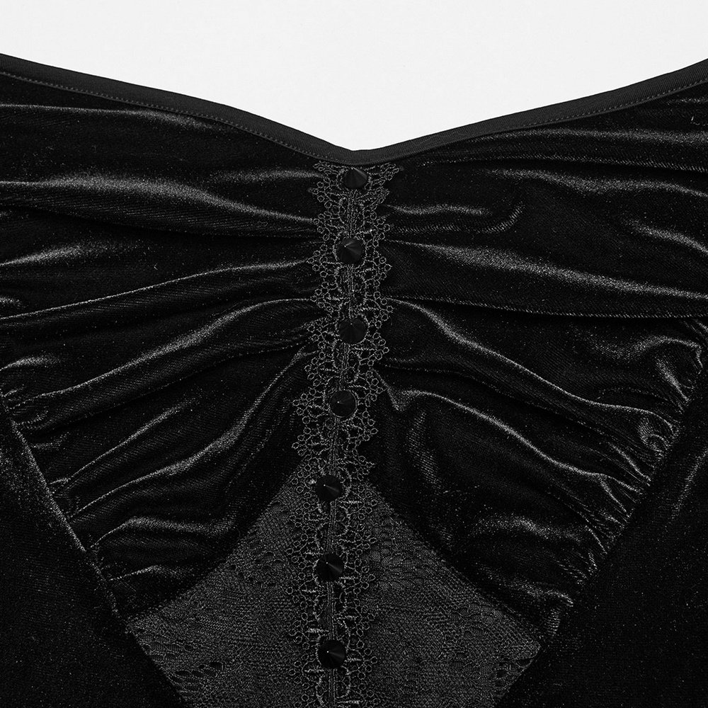 Close-up of the Gothic black velvet gown's heart-shaped chest with lace detailing and decorative buttons.