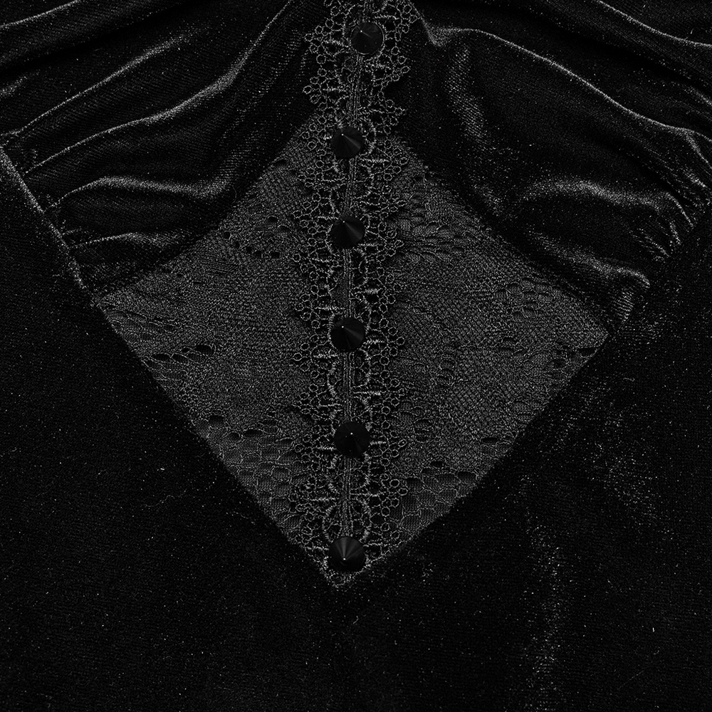 Close-up of gothic black velvet lace panel with buttons on a mermaid dress, highlighting intricate details.