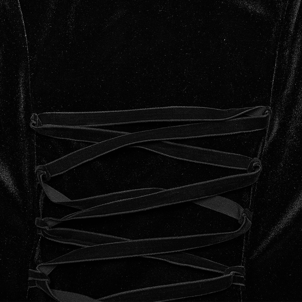 Close-up of gothic black velvet lace-up detailing on evening gown, showcasing elegant texture and design.