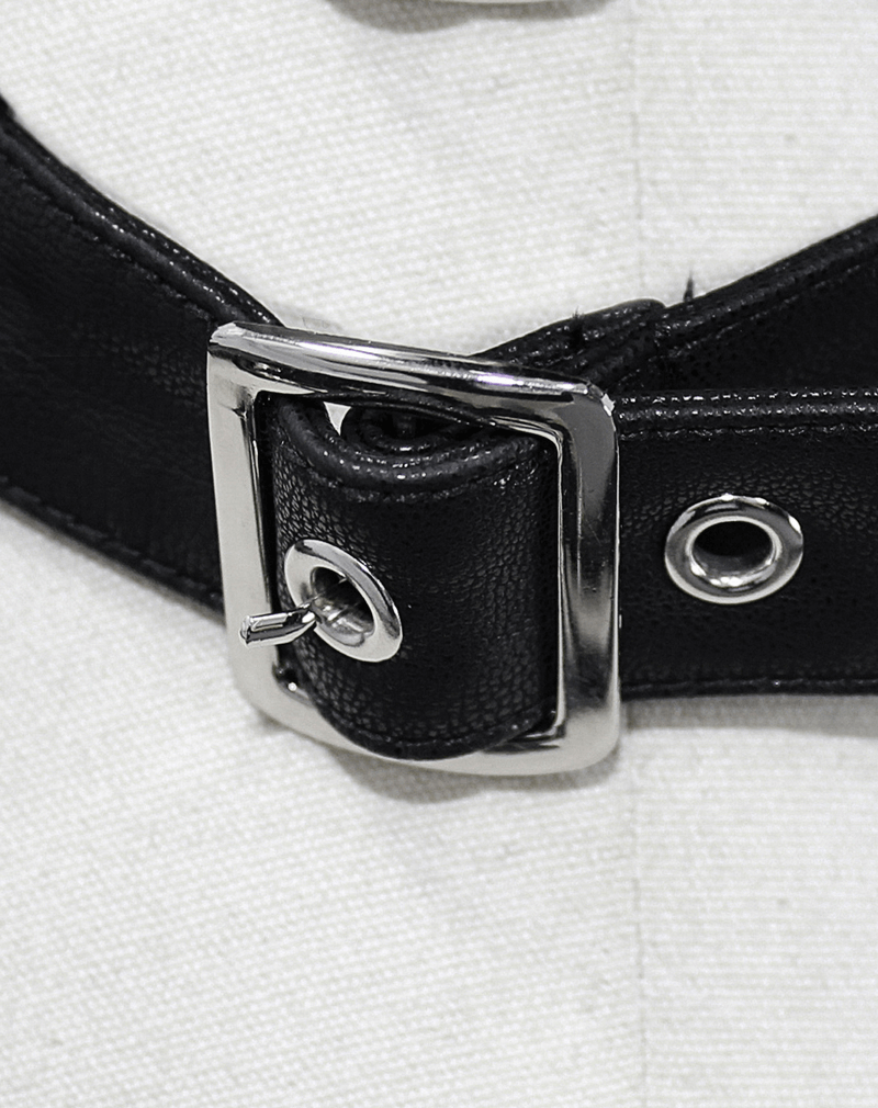 Close-up of a black leather belt with a silver buckle, designed for a gothic style women's coat.