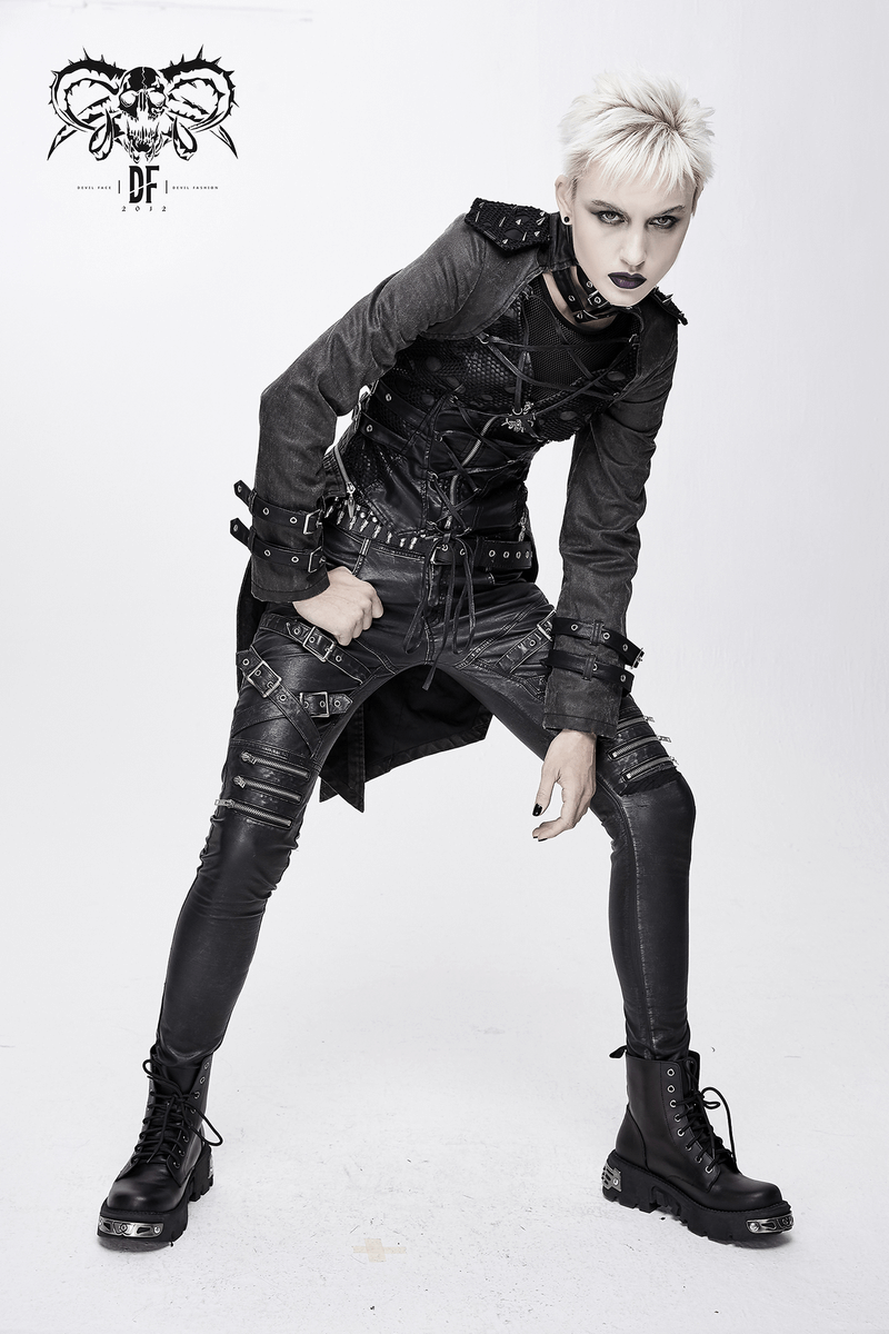 Gothic style women's coat with lace-up design and rivets, stylishly paired with edgy black pants and boots.
