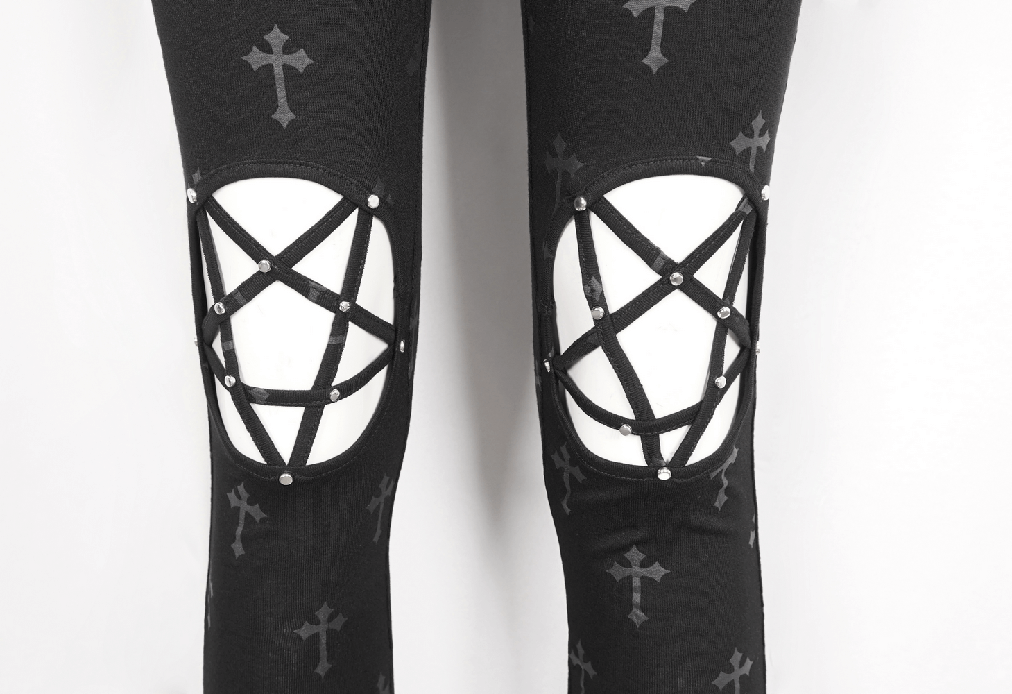 Gothic cross lace-up leggings for women featuring dramatic cross cutouts and stylish knee lace details.