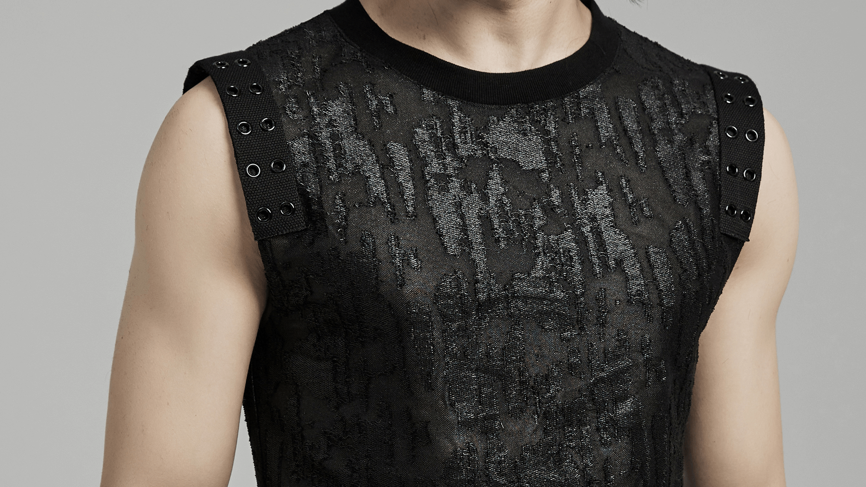 Gothic style black eyelet tank top for men with textured fabric and shoulder webbing detail. Perfect for bold, rebellious fashion.