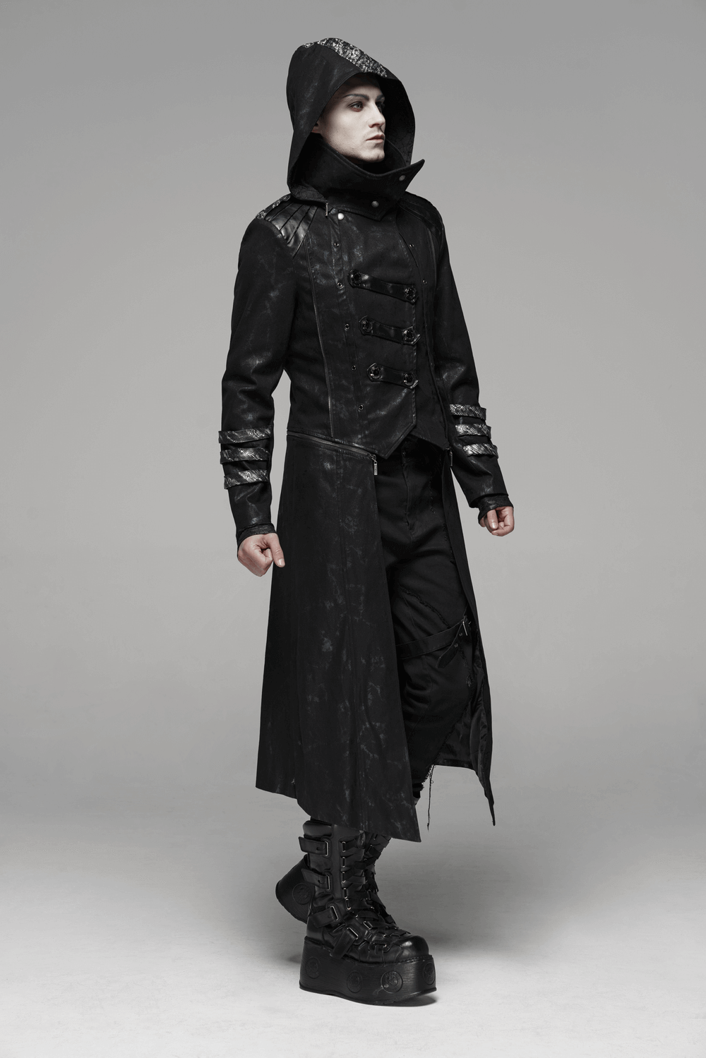 Gothic style men's hooded longline coat with buckles, embodying dark fashion and bold silhouettes.