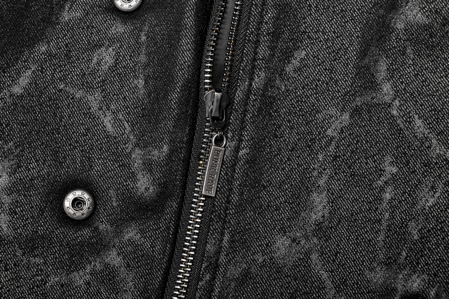 Close-up of a gray jacket showcasing intricate zipper and button details.