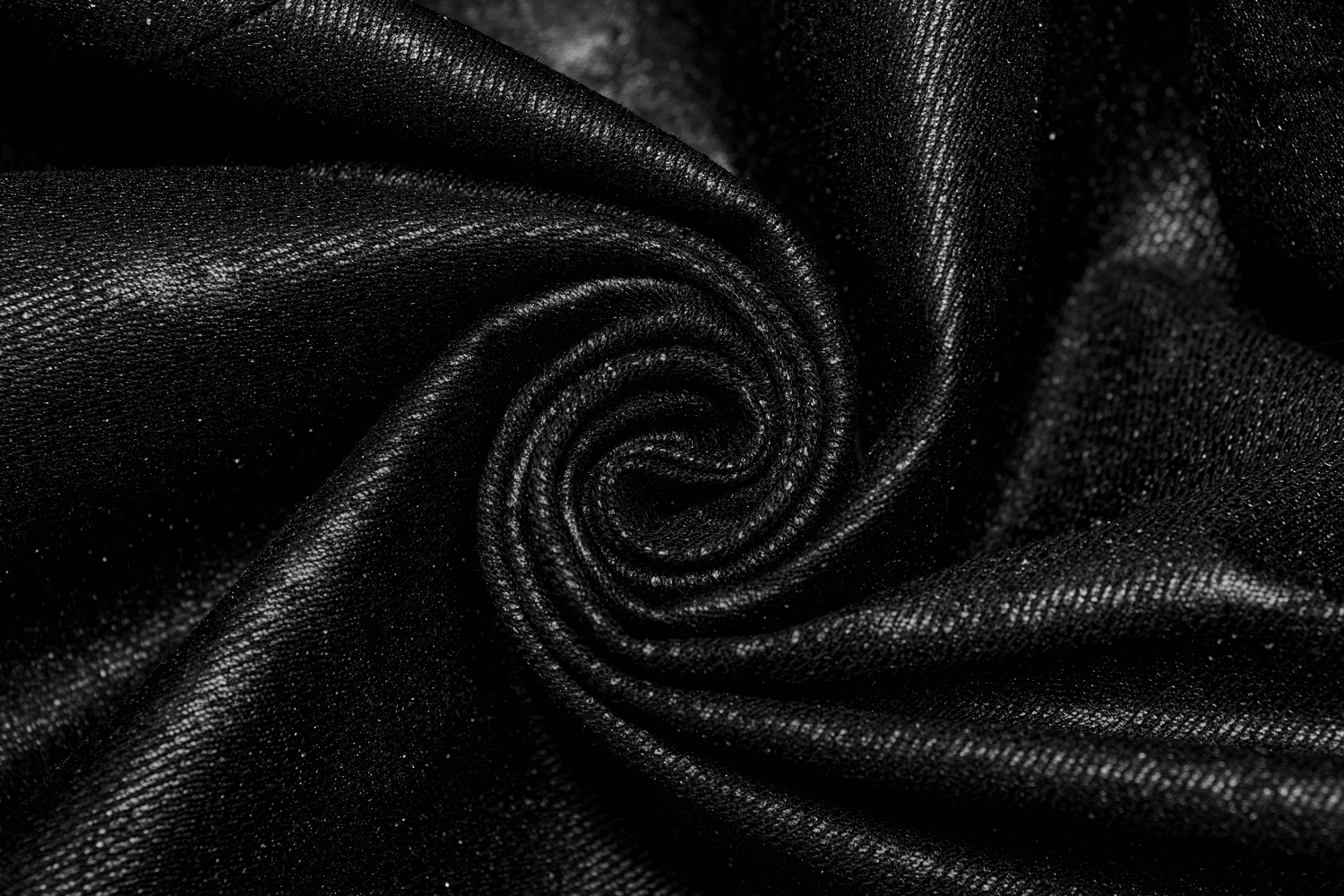 Close-up of luxurious black fabric swirling, perfect for a Gothic style hooded coat.