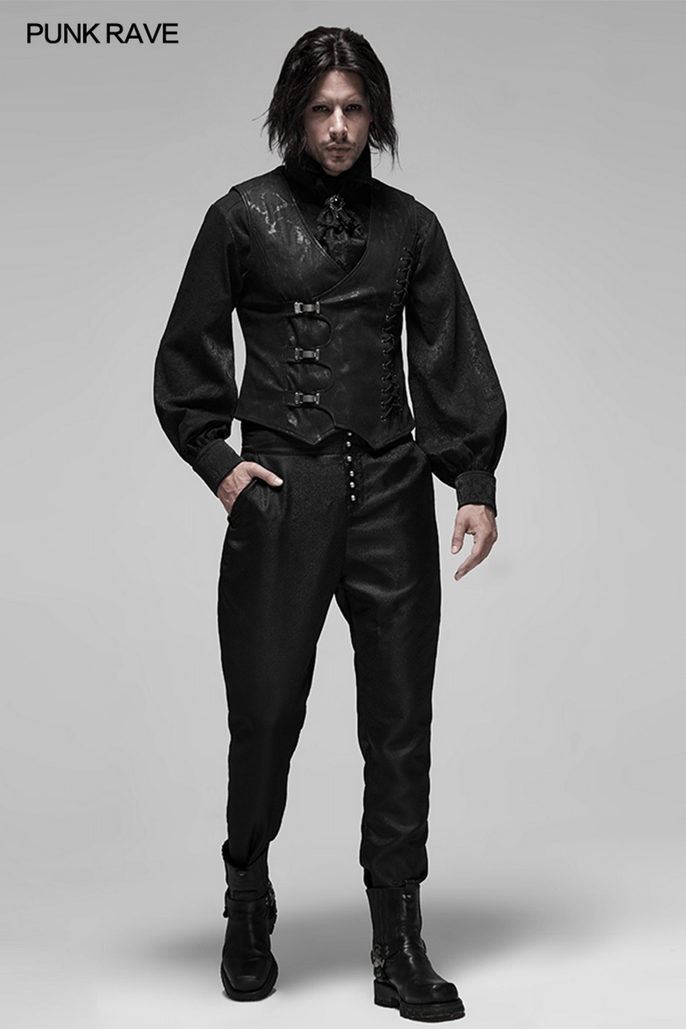 Gothic style men's vest with metal buckles, worn with black pants and boots for a striking edgy look.