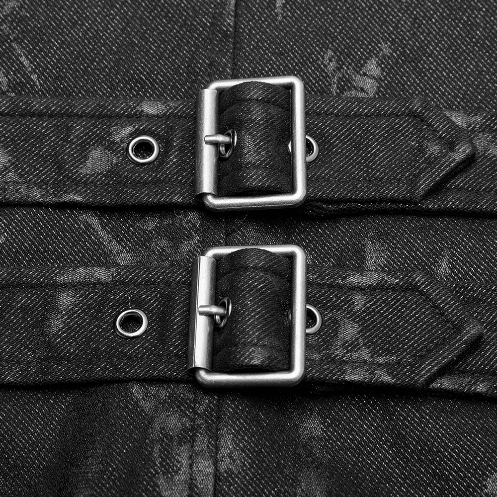 Close-up of metal buckles on a Gothic style men's vest featuring a textured black fabric.