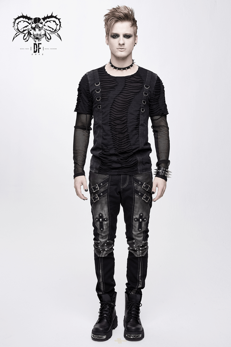 Stylish model in gothic outfit featuring studded black pants and textured top for punk fashion lovers.