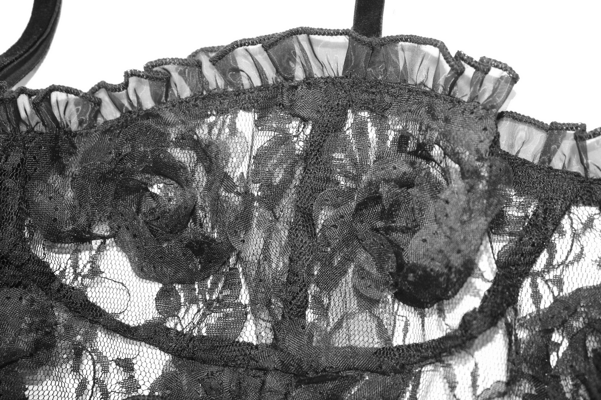 Close-up of gothic style black lace top with ruffled neckline and 3D flower details.