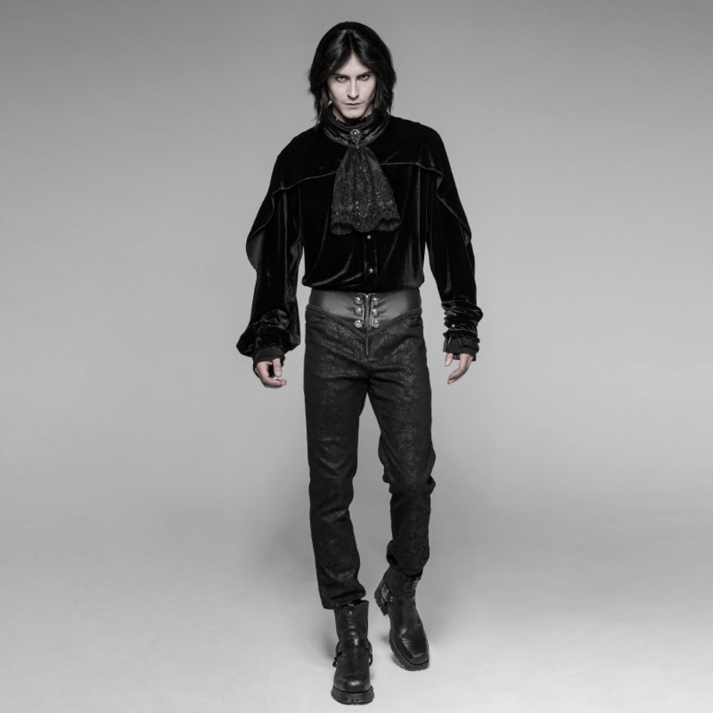 Gothic model in black velvet top and skinny lace up jeans, showcasing edgy fashion statement.