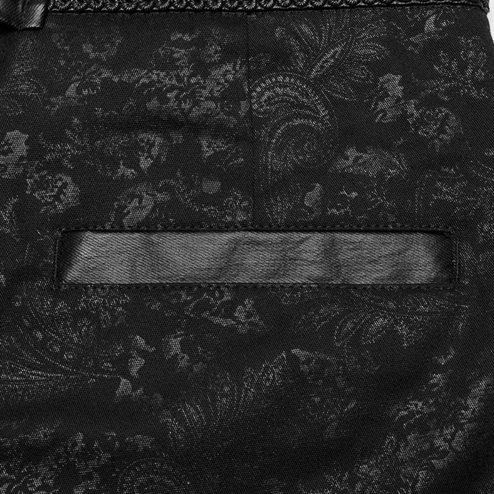 Close-up of gothic black lace-up jeans with embossed fabric and sleek pocket design for an edgy fashion statement.