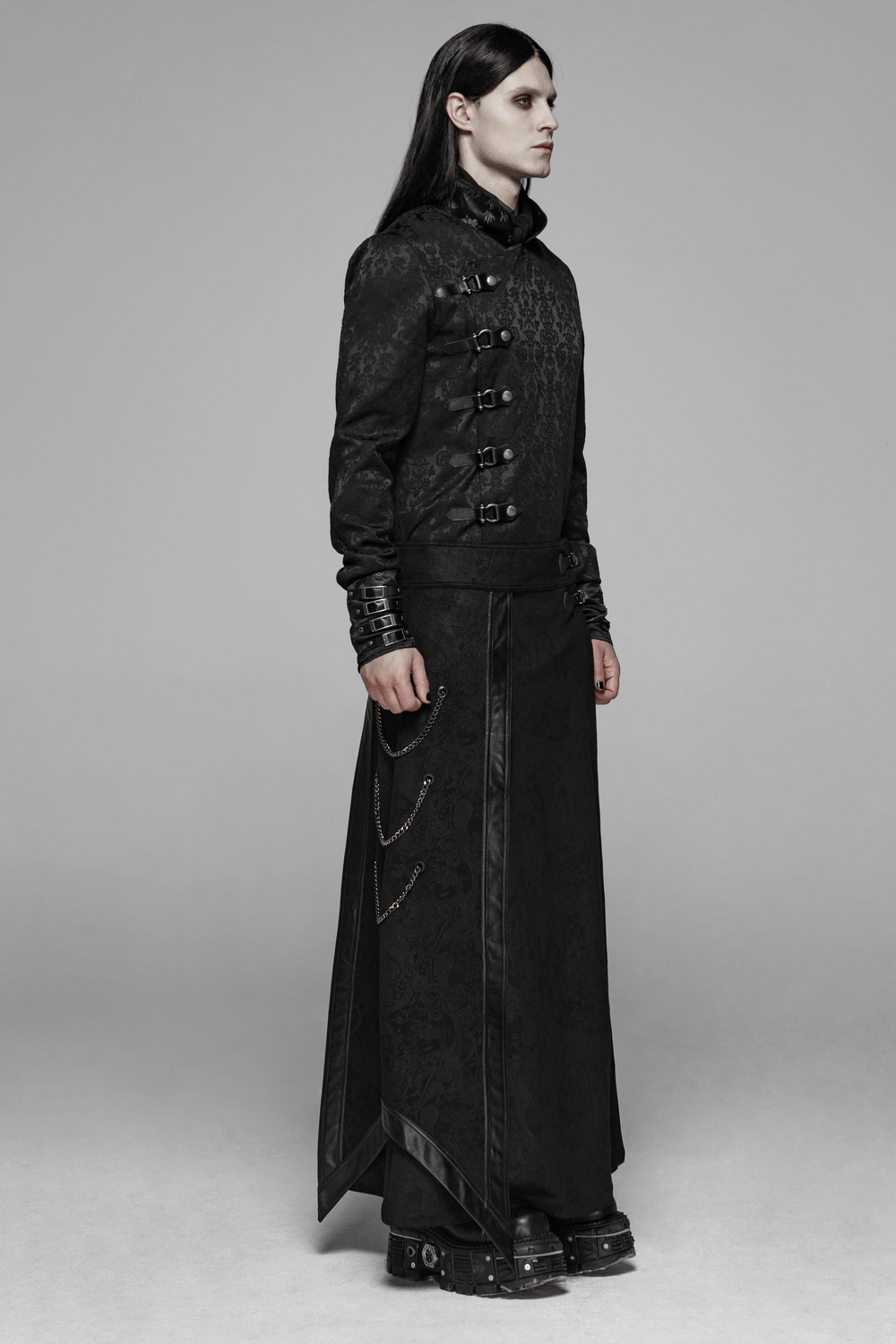 Gothic suede and leather long overskirt with chains worn by a model, showcasing dark elegance and alternative fashion.
