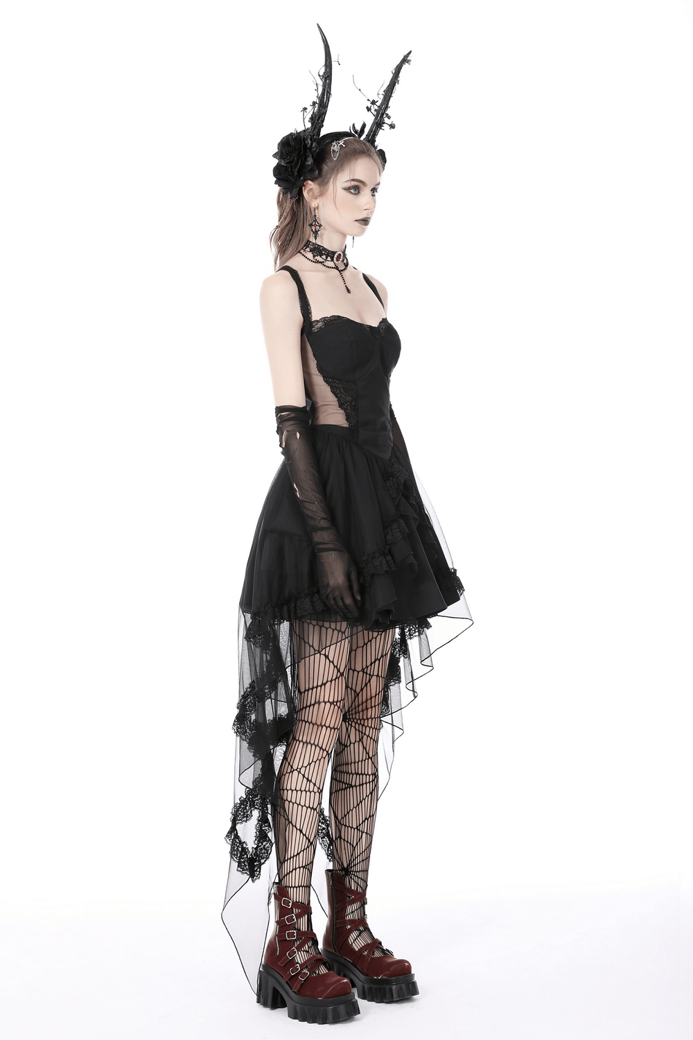 Gothic swallowtail dress in black with lace, layered skirt, and edgy accessories, perfect for dark romantic style.