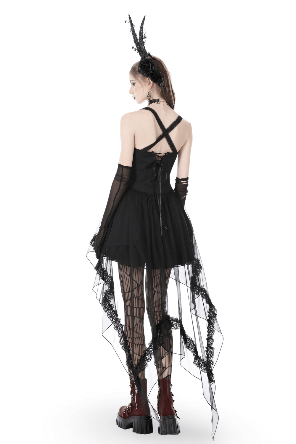 Back view of a gothic swallowtail dress with lace and layered skirt, paired with gloves and striking accessories.