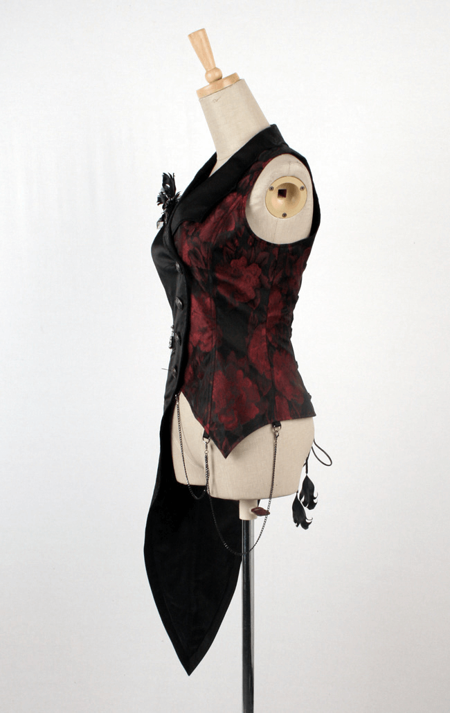 Gothic tailcoat vest featuring asymmetrical hem, chains, and red brocade detail for a vampiric fashion look.