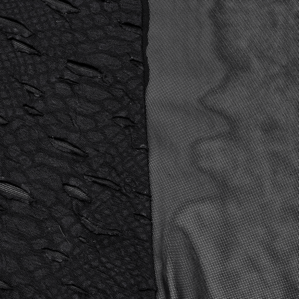 Close-up of Gothic tattered fabric and honeycomb mesh showcasing textures for punk long dress.
