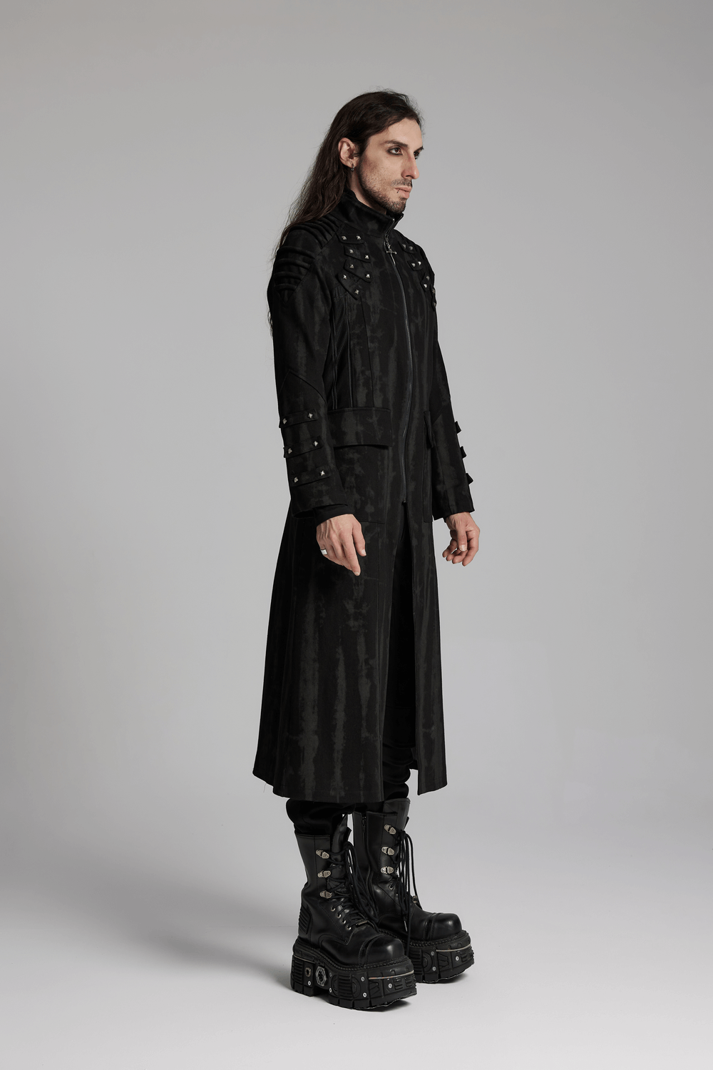 Gothic tie-dye long coat with rivets, mesh details, and adjustable drawstring worn by model in platform boots.