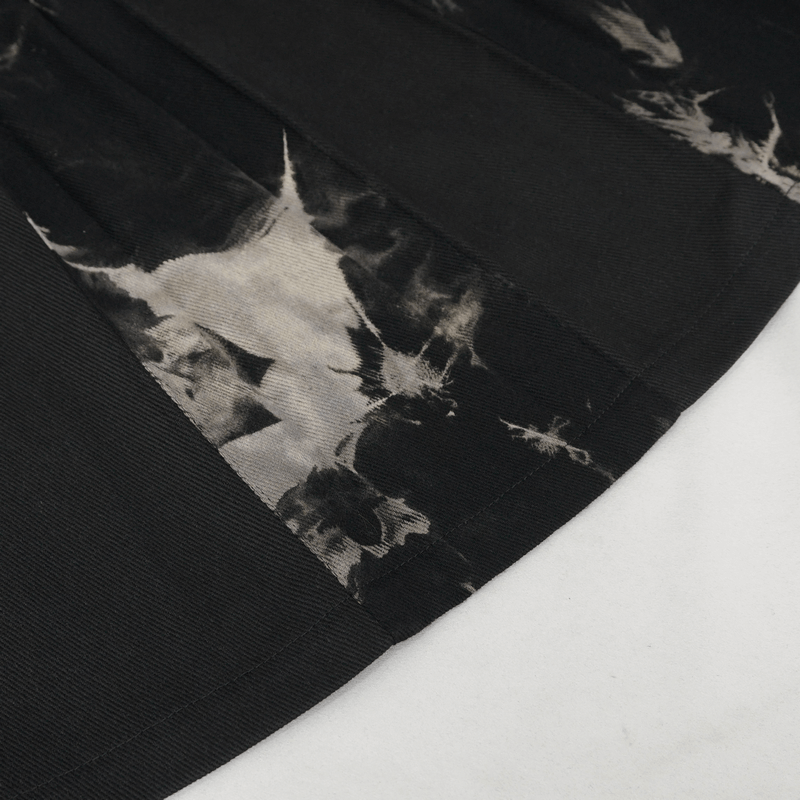 Close-up of gothic tie-dyed kilt fabric showcasing bold tie-dye pattern and layered texture.