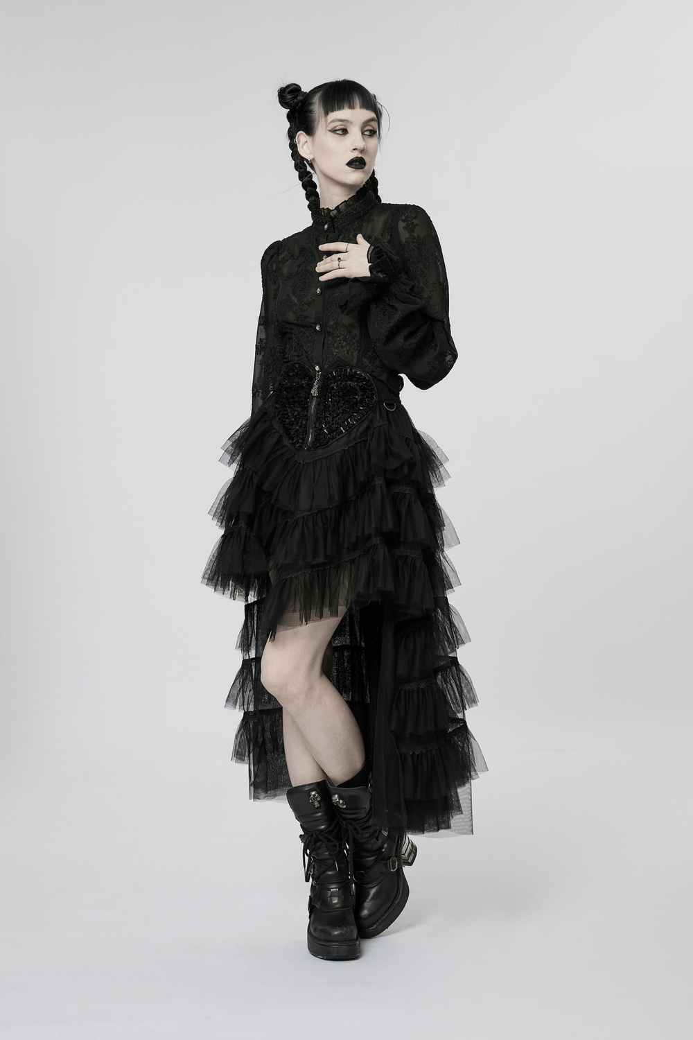 Edgy model in Gothic tiered tulle ruffle skirt with skeleton hand zipper and lace details, perfect for a cool girl outfit.