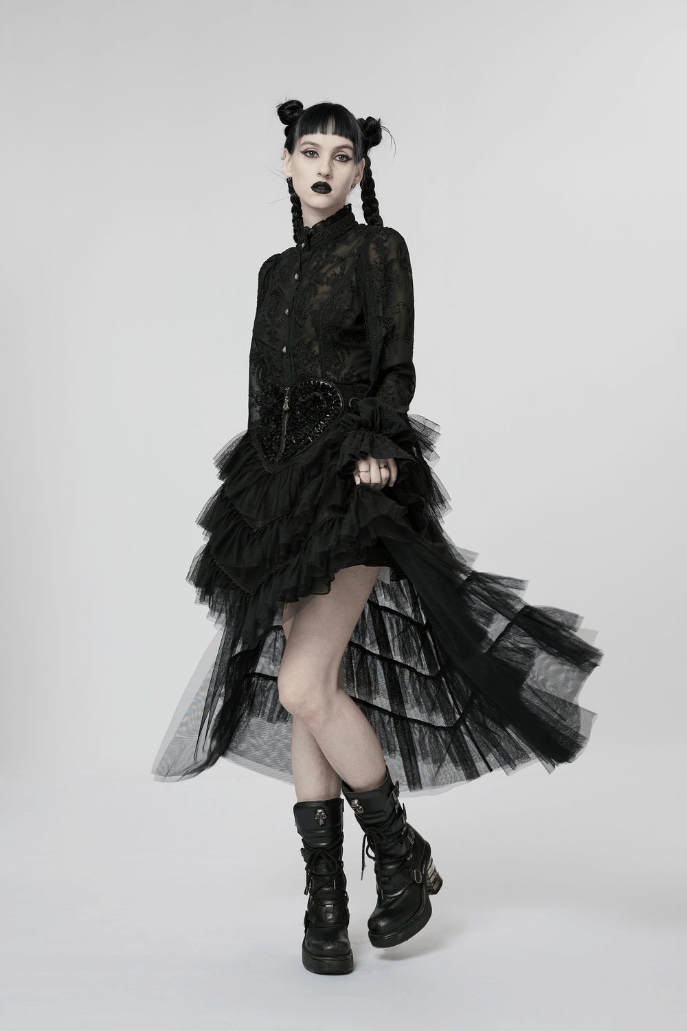 Gothic tiered tulle ruffle skirt with lace top and stylish black boots, perfect for edgy fashion lovers.