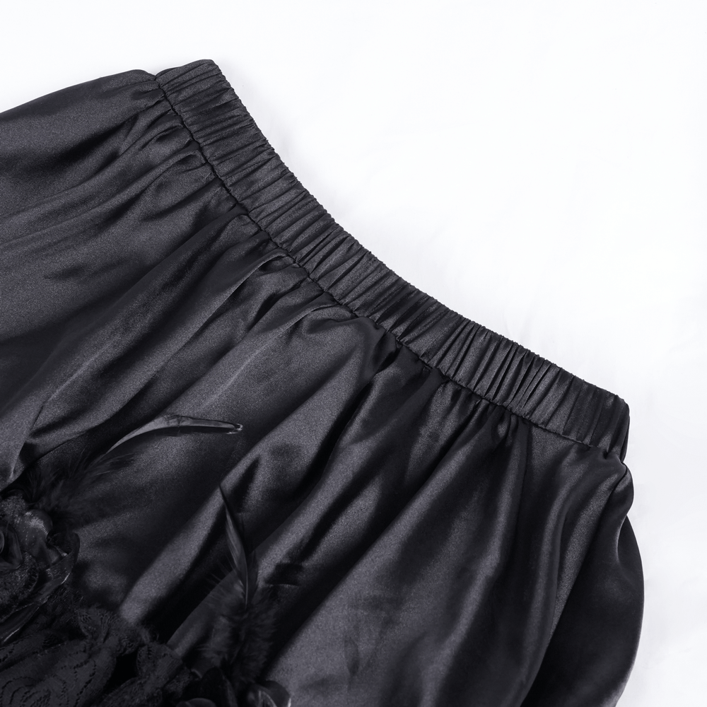 Close-up of the elastic waistband of a Gothic tulle skirt, showcasing its smooth black fabric and elegant design.