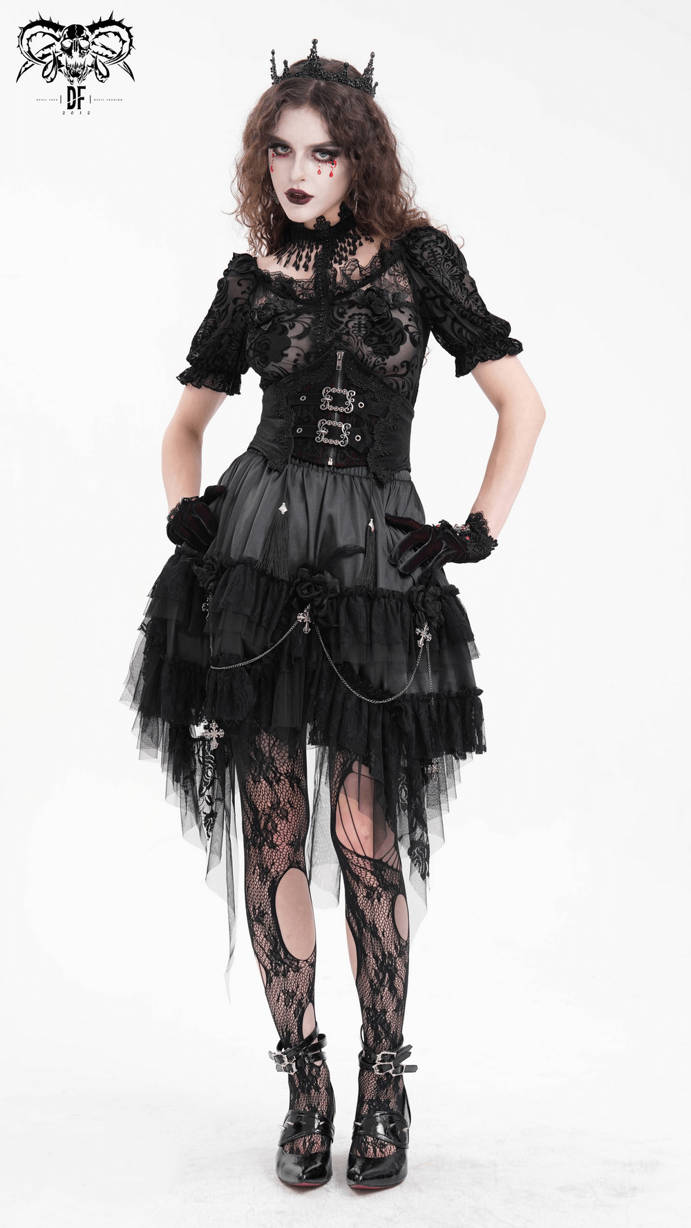 Gothic tulle skirt with lace details and chains, worn by model. Perfect for alternative fashion lovers.