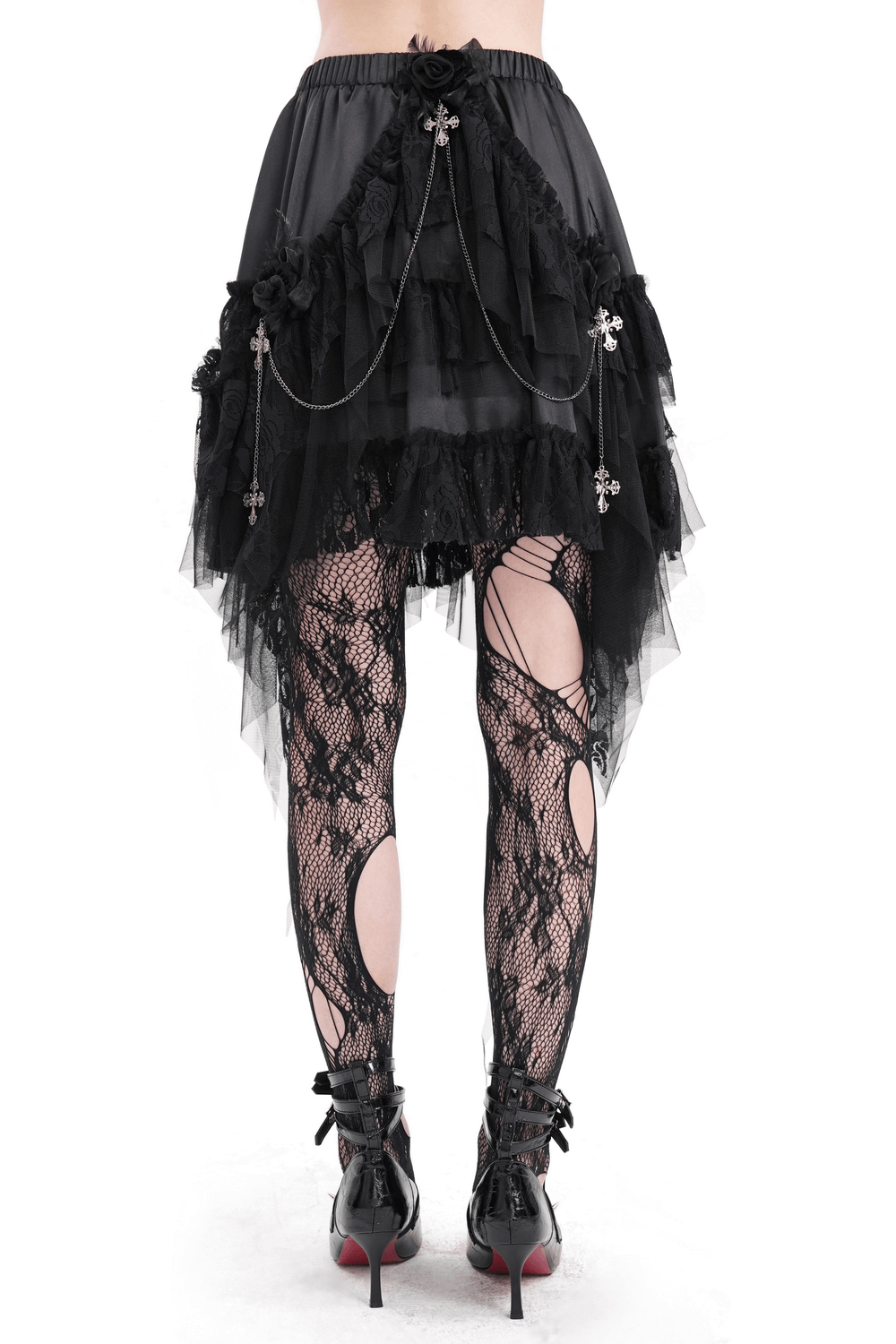 Gothic tulle skirt with lace and chains, layered black design, paired with stylish fishnet tights for alternative fashion.
