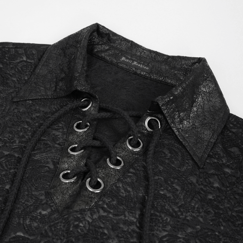 Close-up of a gothic black shirt featuring a lace-up front and textured jacquard fabric.