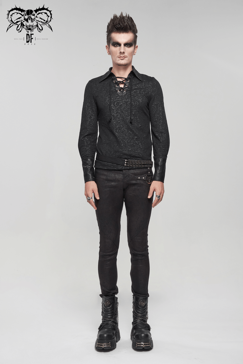 Gothic black long sleeve shirt with lace-up, styled by a model in edgy black jeans and boots, showcasing vintage fashion.