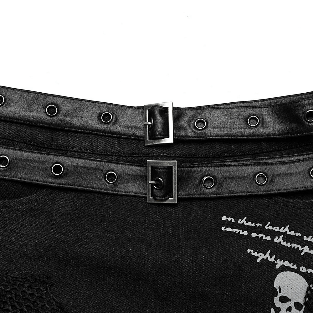 Close-up of the detachable belt with eyelets on the Gothic twill and mesh skirt featuring a skull print design.
