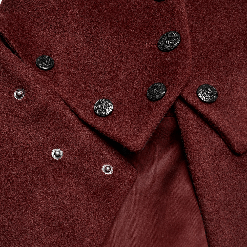 Close-up of a luxurious red gothic coat featuring ornate buttons and elegant fabric details.