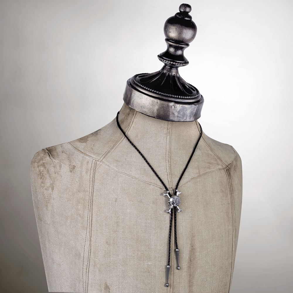 Gothic Unforgiven Skull Pendant with Crossbones displayed on a mannequin with a stylish black leather neck tie.
