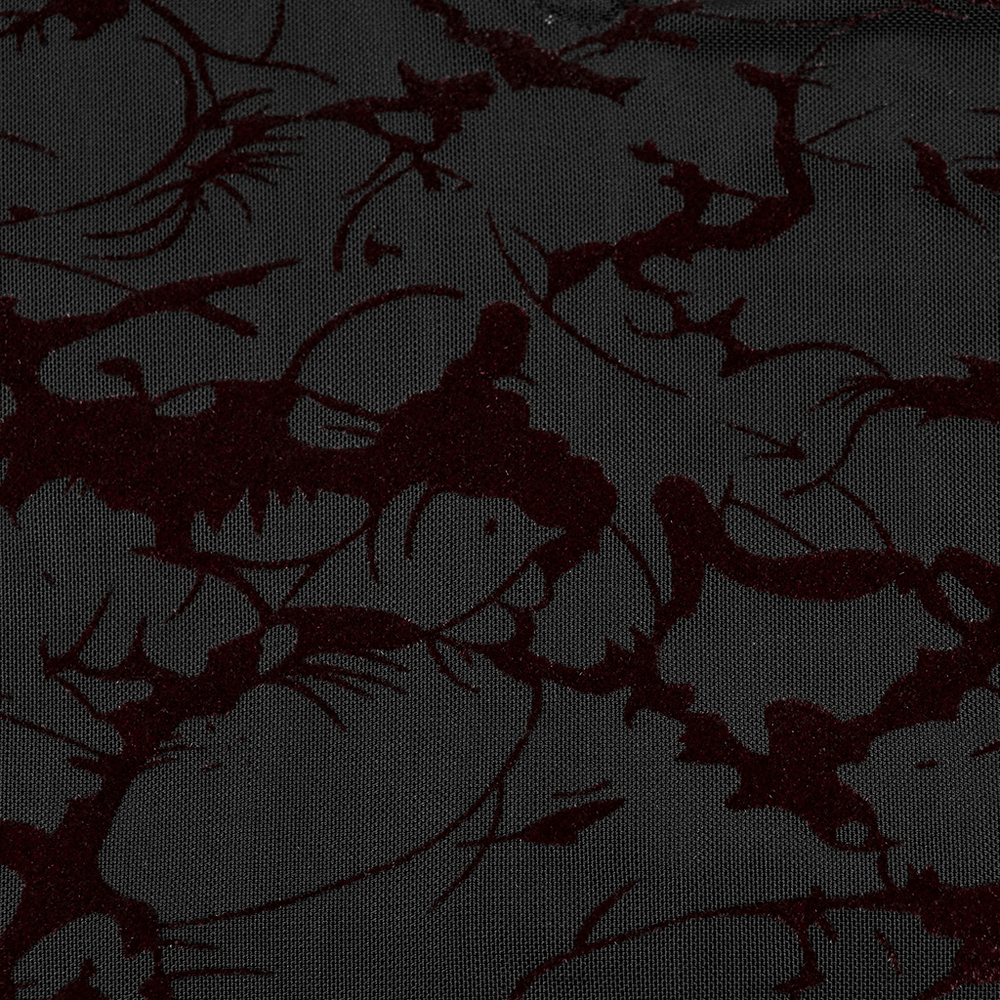 Close-up of Gothic black fabric with dark red abstract pattern, perfect for elegant dress designs.