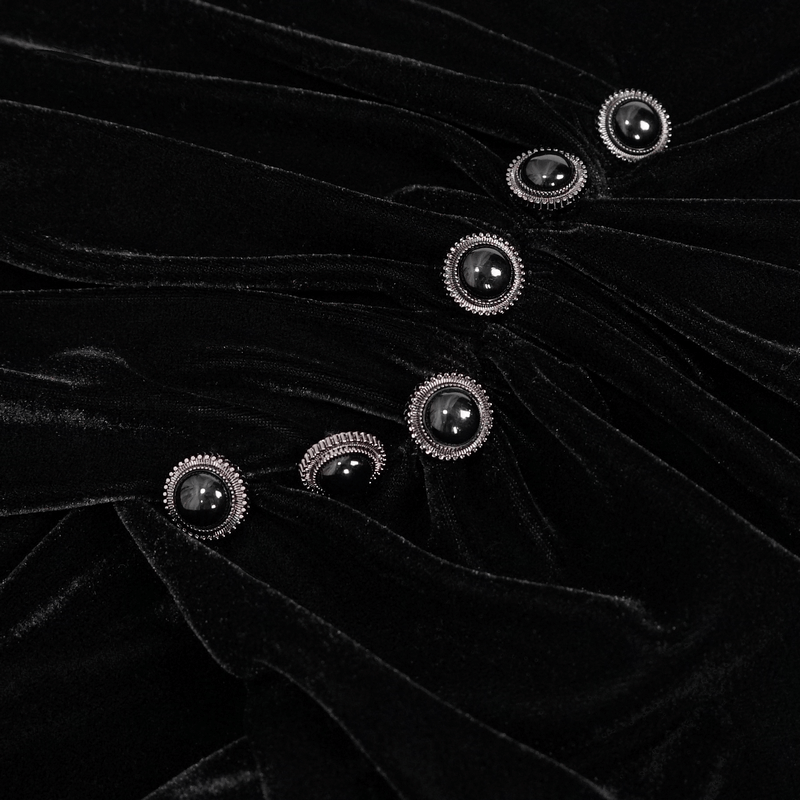 Close-up of black velvet fabric with elegant buttons from a gothic V-neck long sleeve dress. Elegant vintage style.