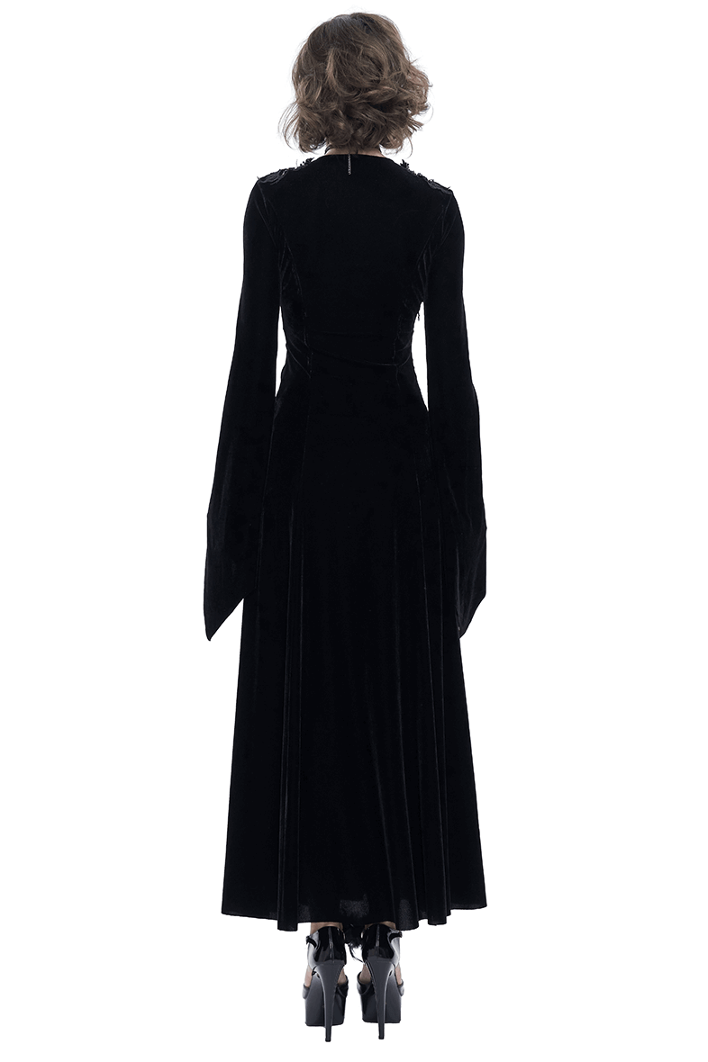 Back view of a women's black velvet long sleeve gothic dress, showcasing an elegant and flowing style.