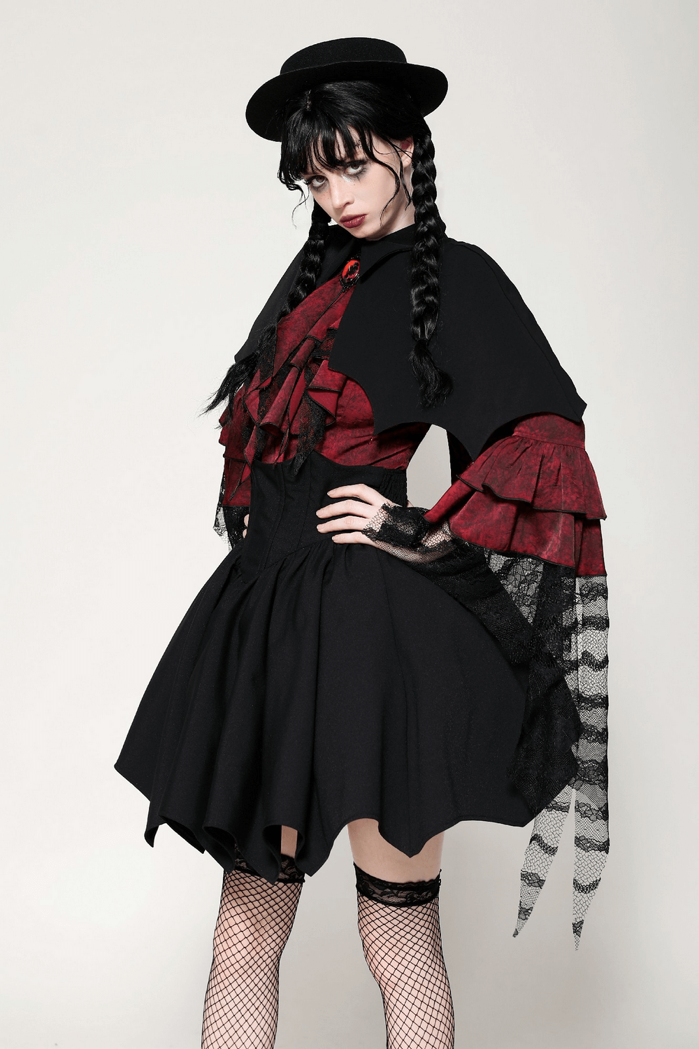 Gothic vampire cape with high collar, blood-red lining, and bat-wing silhouette, perfect for cosplay or Halloween.