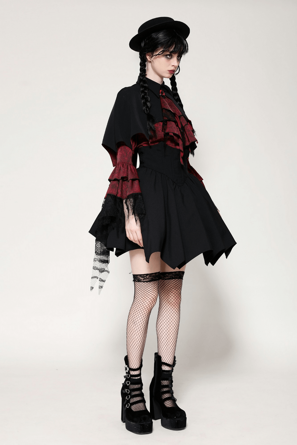 Gothic vampire cape with blood red lining worn by a model in dramatic outfit, perfect for Halloween or cosplay.