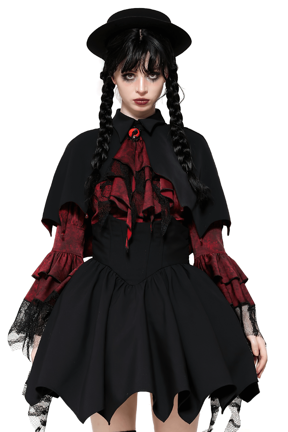 Woman in Gothic vampire cape with high collar and jewel clasp, featuring a blood-red ruffled shirt and black hat, exuding a dramatic flair.