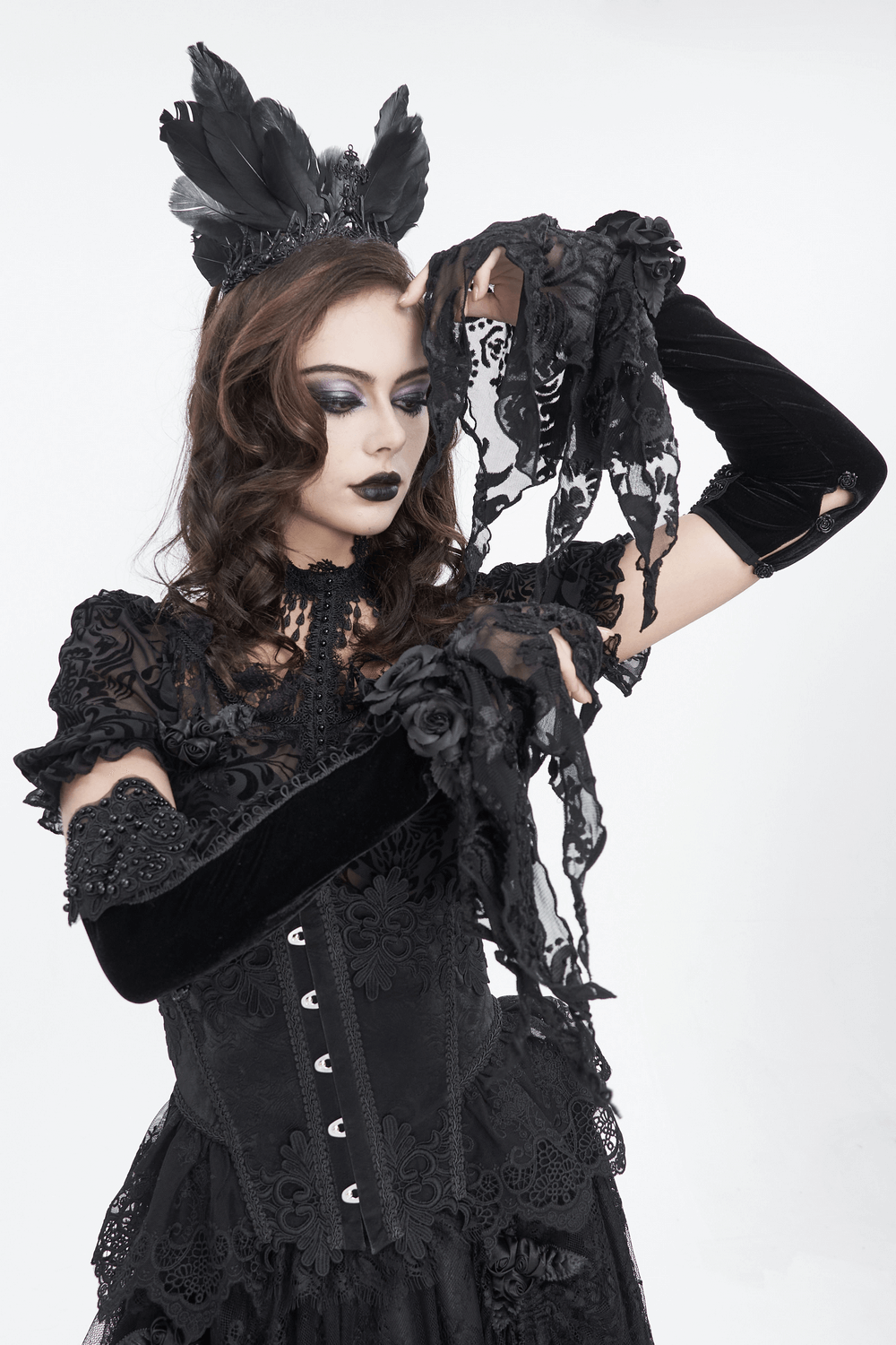 Gothic velvet and lace evening gloves worn by model, showcasing dramatic style and elegance.