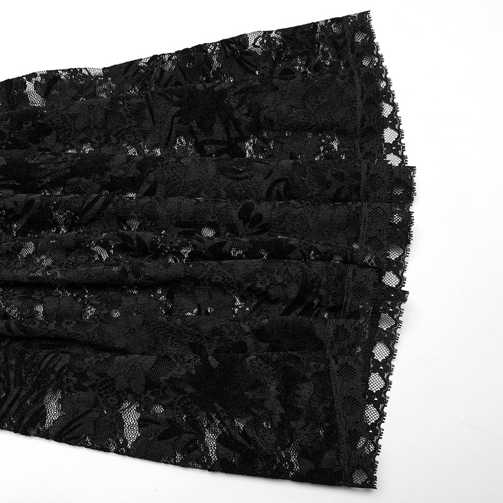 Black lace fabric featuring floral patterns and elegant trim for flared pants in gothic fashion.